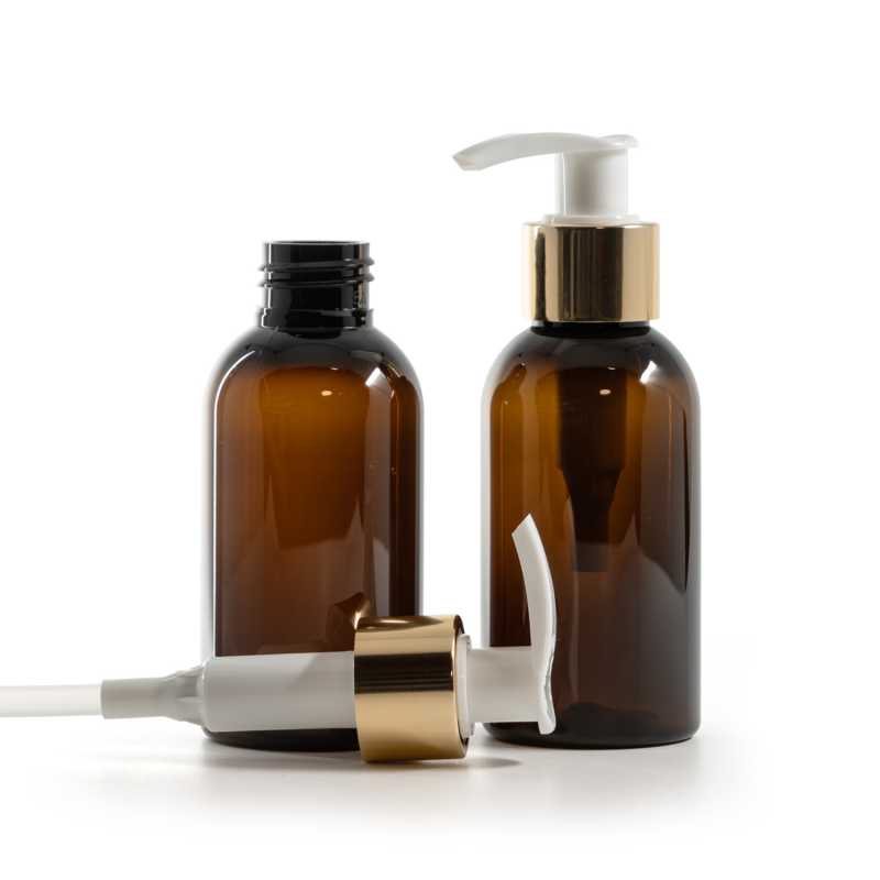 Bouteille en plastique ambrée, pompe à lotion blanche avec col en or brillant, 100 ml