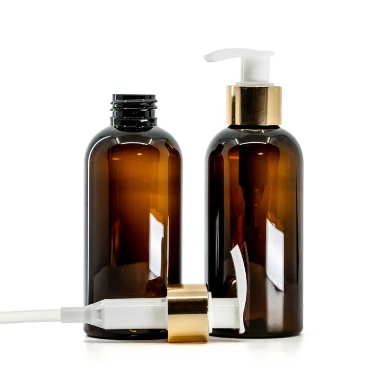 Bouteille en plastique ambrée, pompe à lotion blanche avec col en or brillant, 150 ml