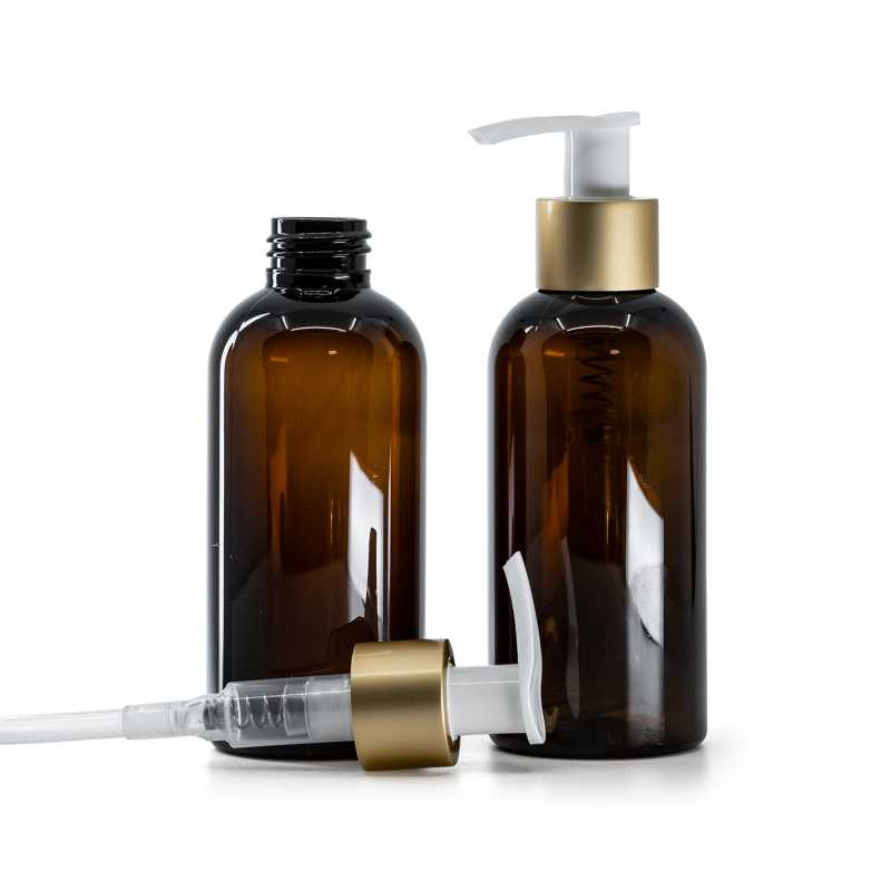 Flacon en plastique brun avec pompe lotion blanche et bague dorée mate 150 ml