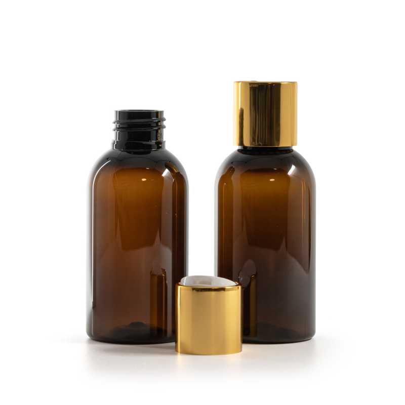 Bouteille en plastique ambrée, bouchon en plastique blanc avec col en aluminium doré, 100 ml