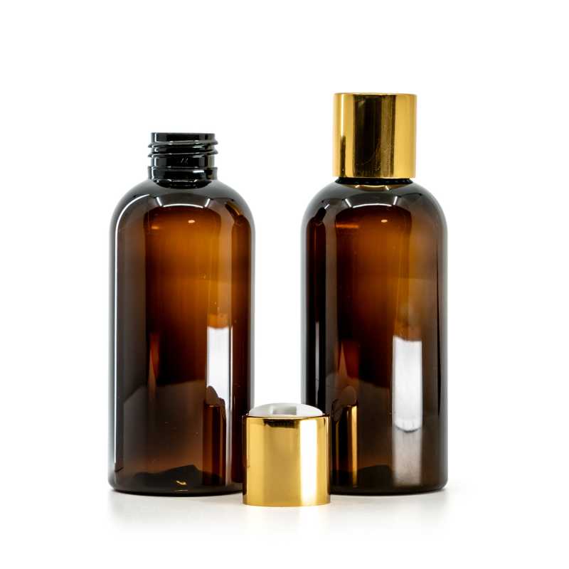 Bouteille en plastique ambrée, bouchon en plastique blanc avec col en aluminium doré, 150 ml