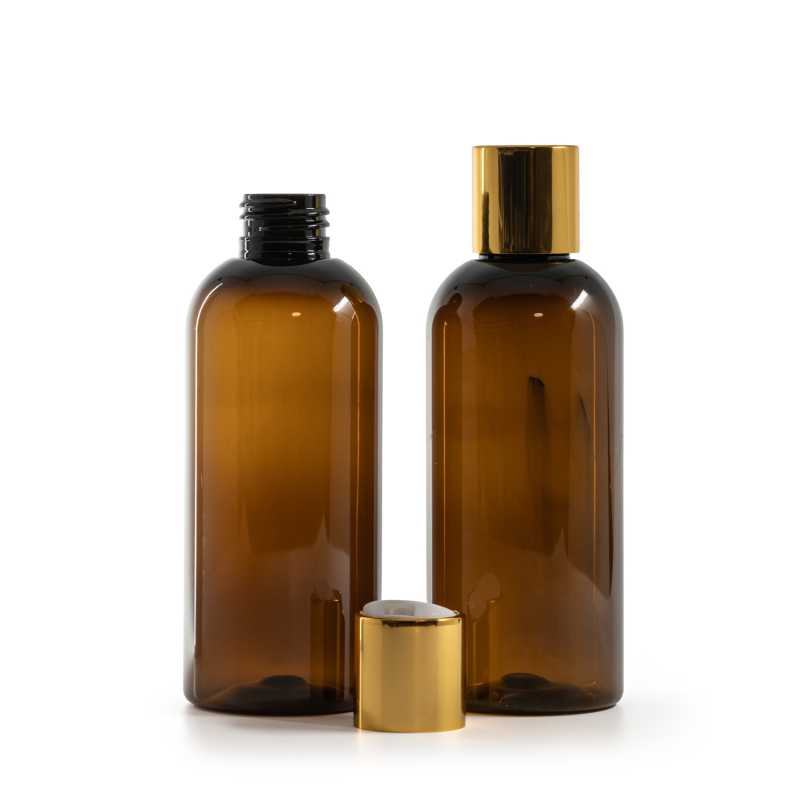 Bouteille en plastique ambrée, bouchon en plastique blanc avec col en aluminium doré, 200 ml