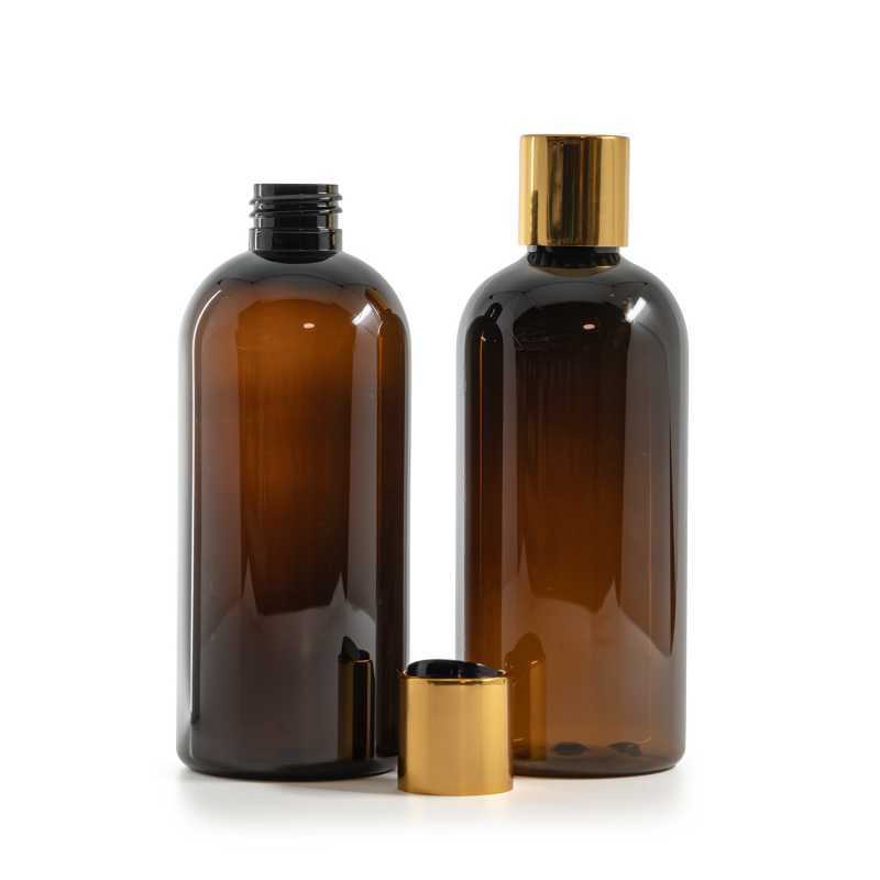 Bouteille en plastique ambrée, bouchon en plastique noir avec col en aluminium doré, 300 ml