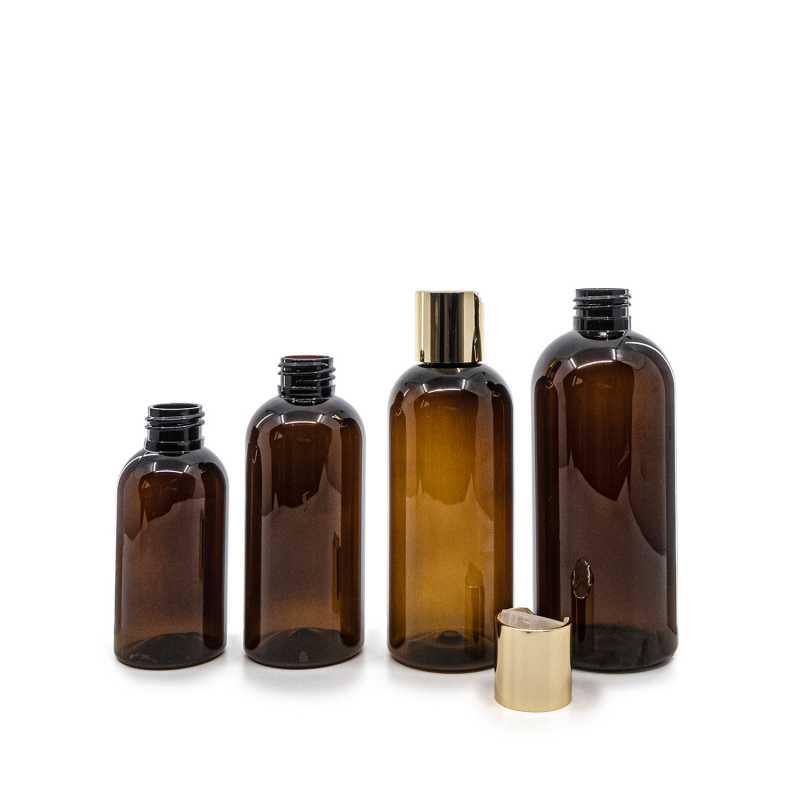 Bouteille en plastique ambrée, bouchon à disque doré, 100 ml