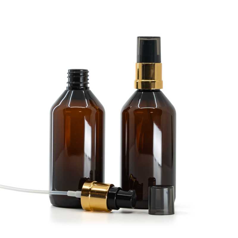 Flacon en plastique brun, distributeur noir et doré brillant avec surcapuchon fumé, 115 ml
