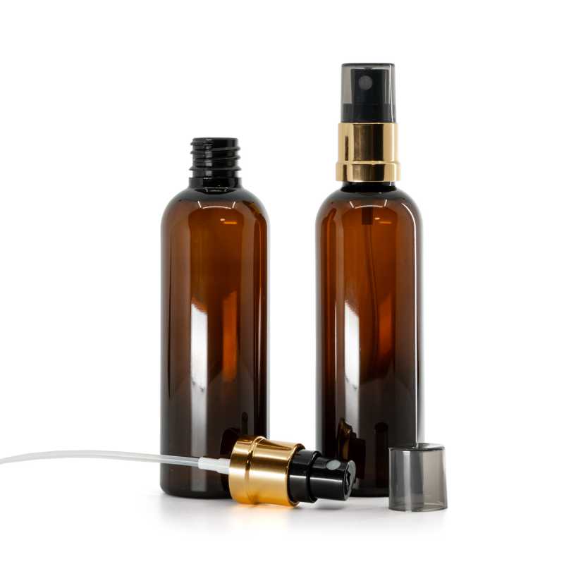 Flacon en plastique ambré, pompe spray noir-or, capot fumé, 100 ml