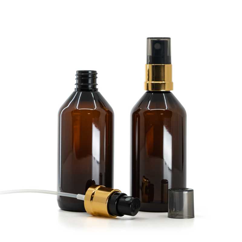 Flacon plastique ambré, pompe spray noir et or, surcapot fumé, 115 ml