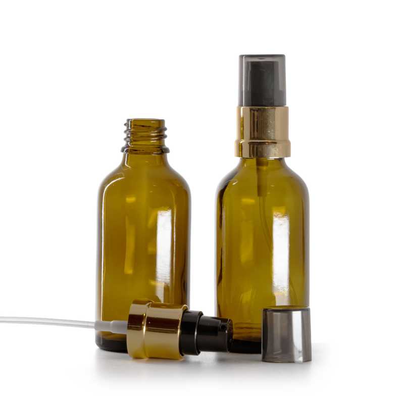 Flacon en verre brun, pompe noire et dorée brillante avec surcapuchon fumé, 50 ml