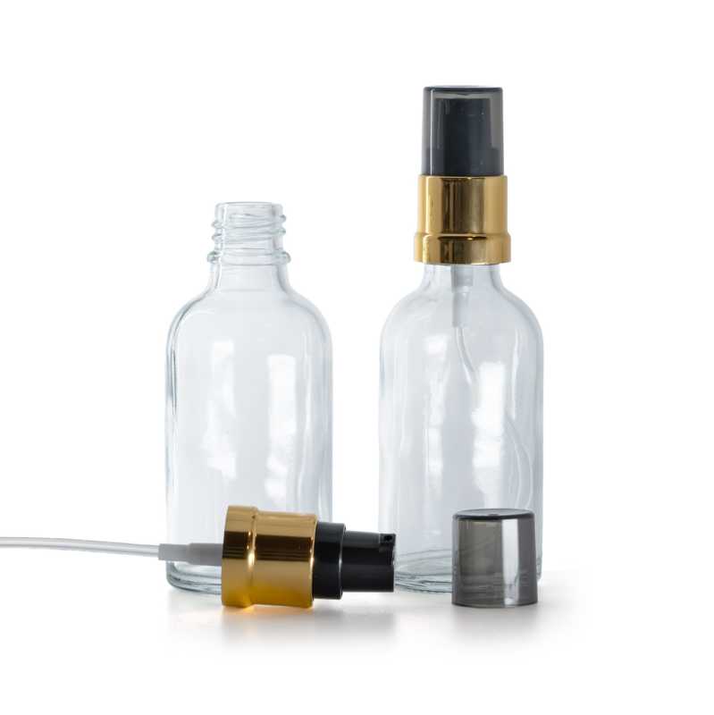 Flacon en verre transparent avec pompe noire et dorée brillante 30 ml