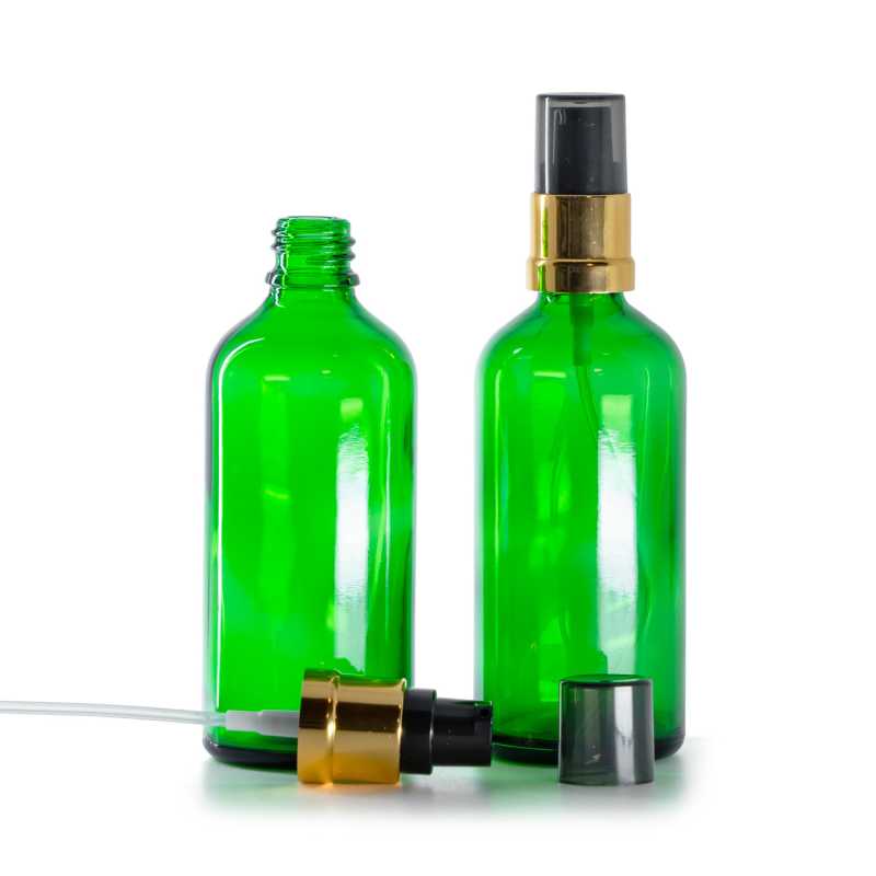 Flacon en verre vert, distributeur noir et doré brillant avec surcapuchon fumé, 100 ml