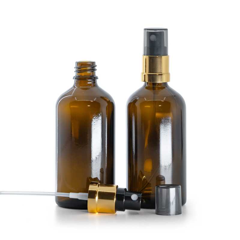 Flacon en verre brun, vaporisateur noir et doré, surcapuchon fumé, 100 ml